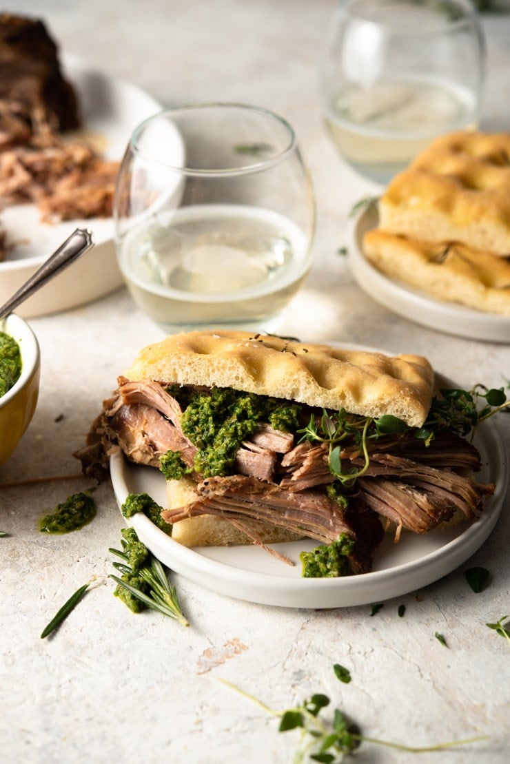 Slow cooker pulled pork shoulder on a sandwich