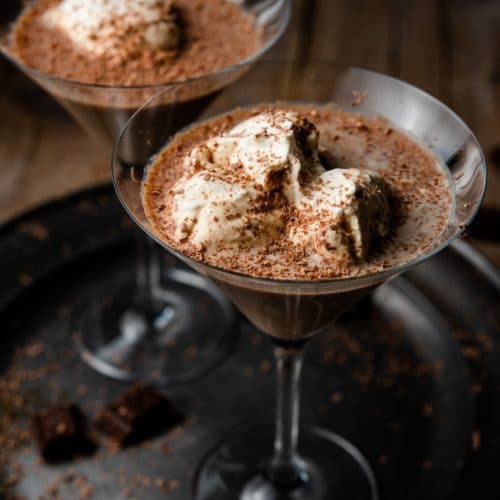 A close up of a chocolate martini on a pewter plate
