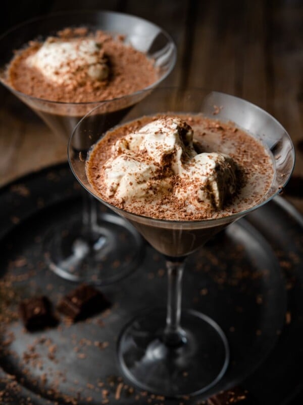 A close up of a chocolate martini on a pewter plate