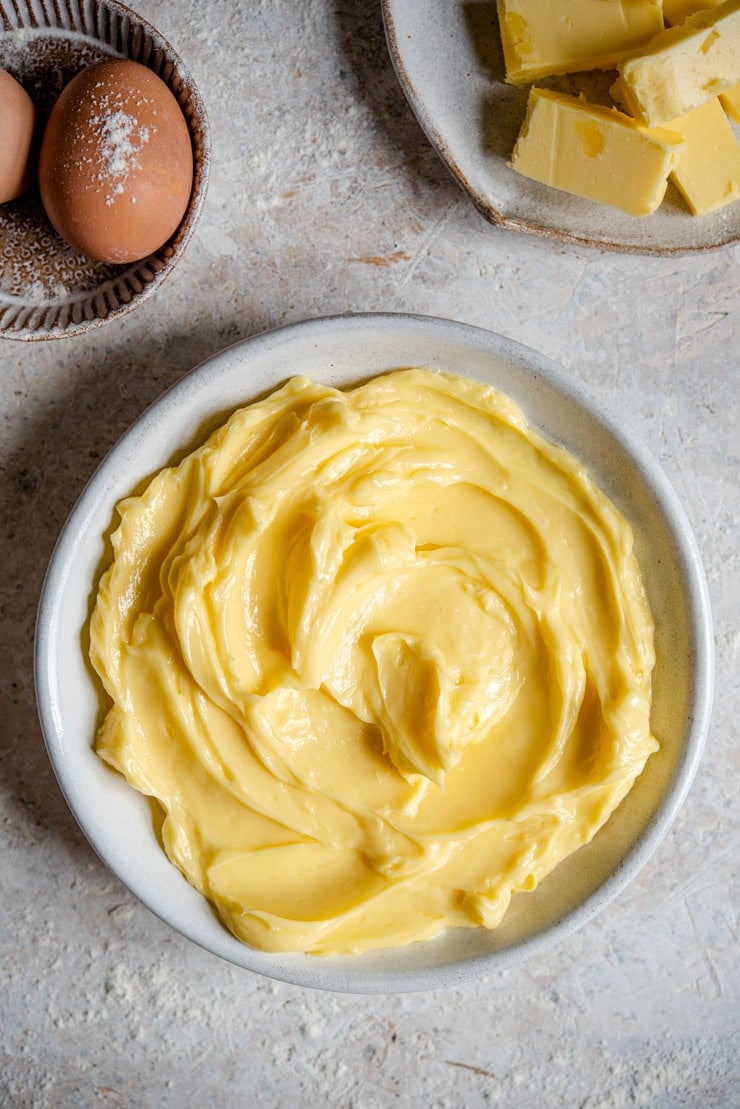 An overhead shot of softened butter in a bowl