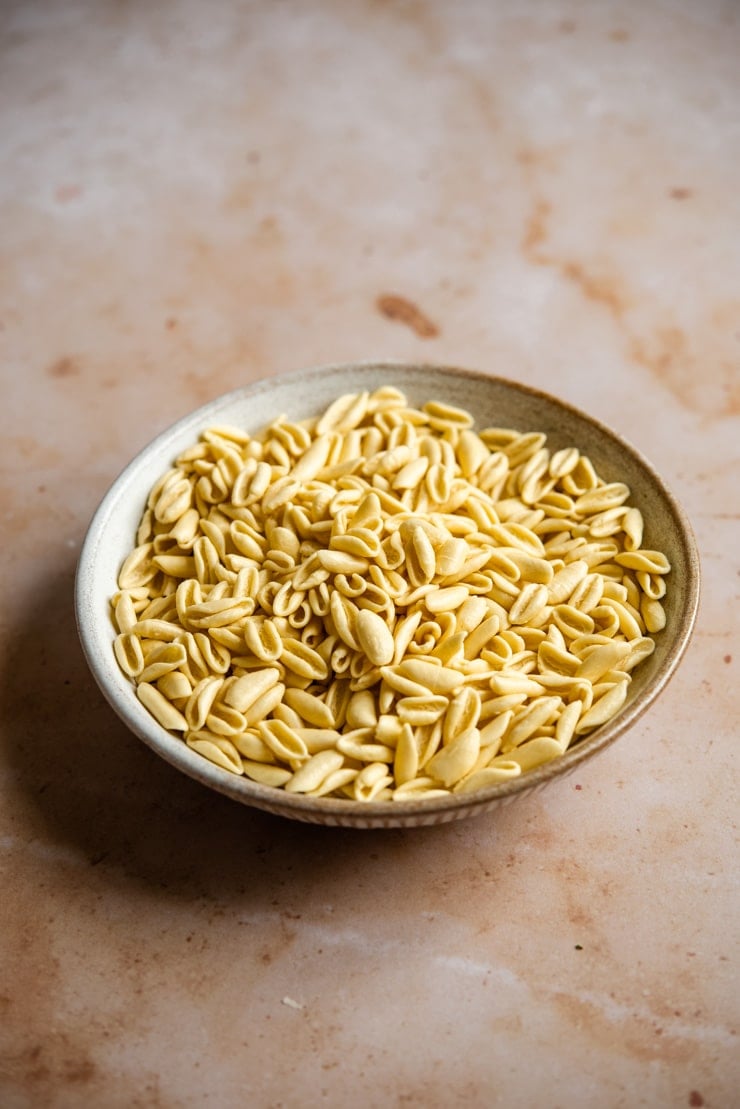 A close up of uncooked cavatelli pasta
