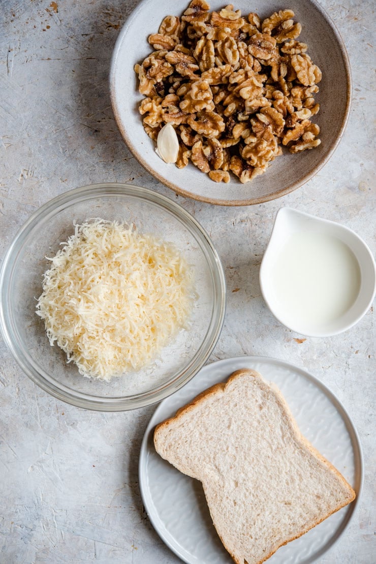 An overhead shot of ingredients for making walnut sauce