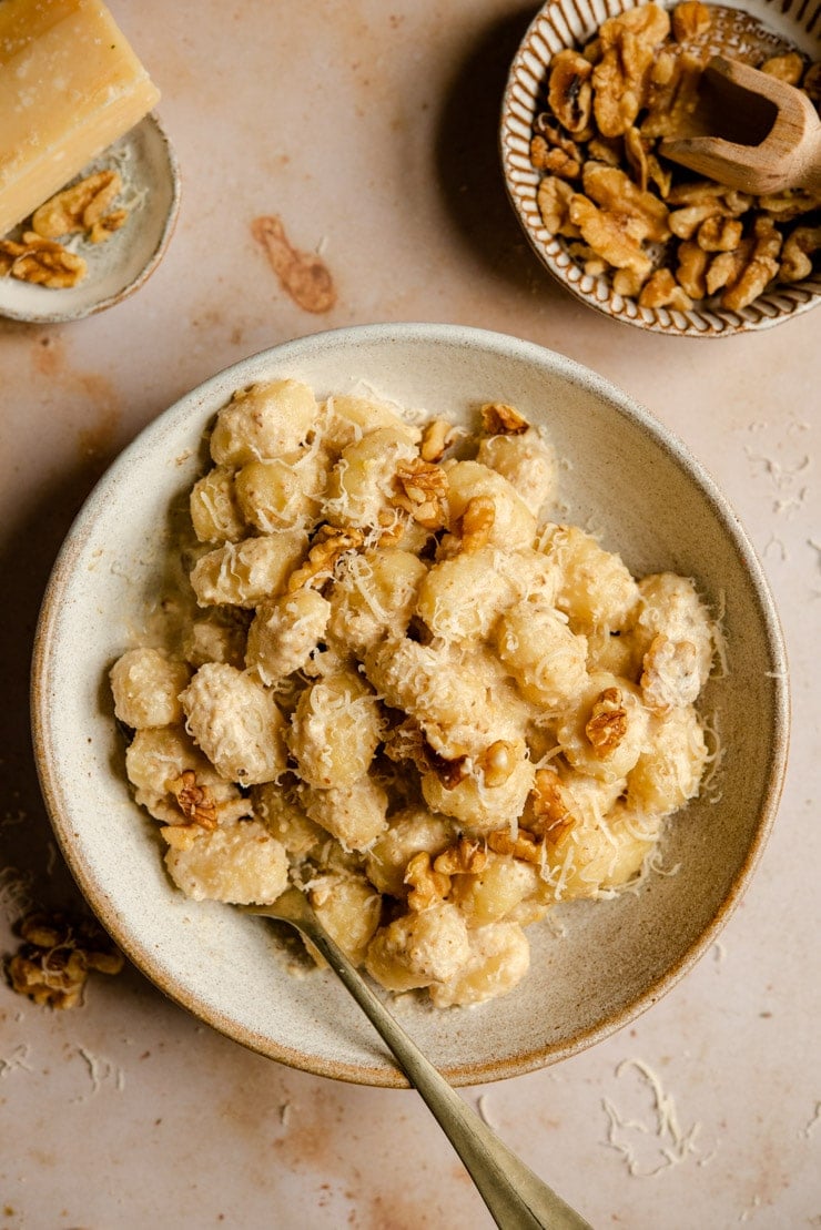 Walnut sauce in a bowl with gnocchi