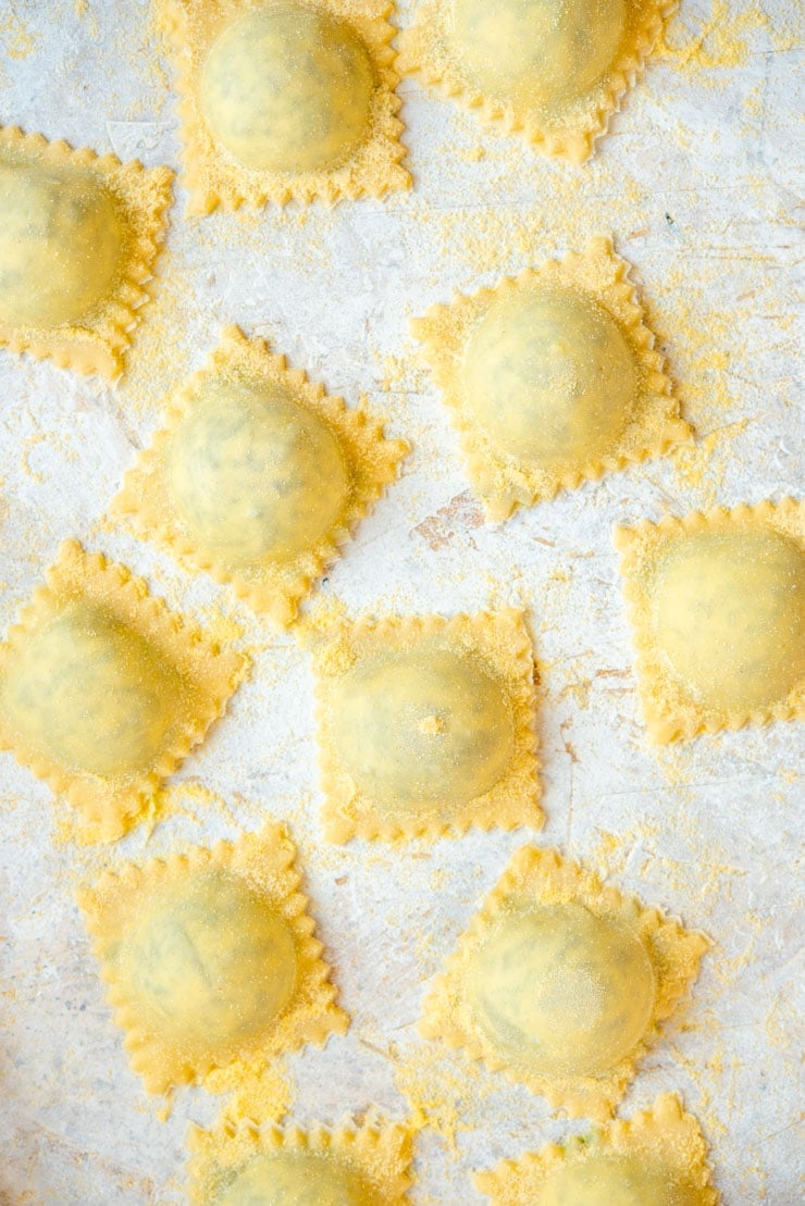 A close up of homemade ravioli before being cooked