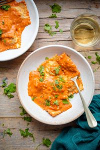 An overhead shot of lobster ravioli in a bowl