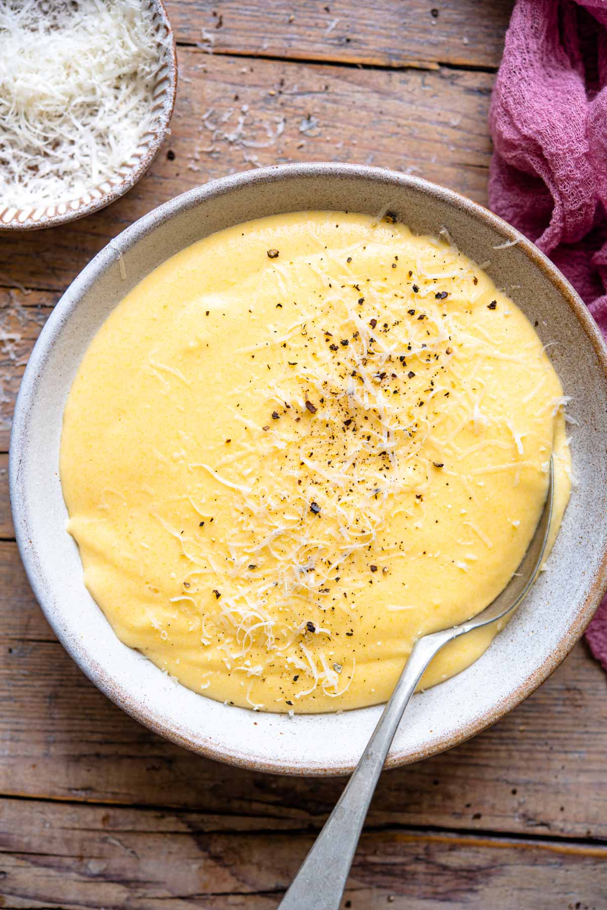 An overhead shot of creamy polenta in a bowl