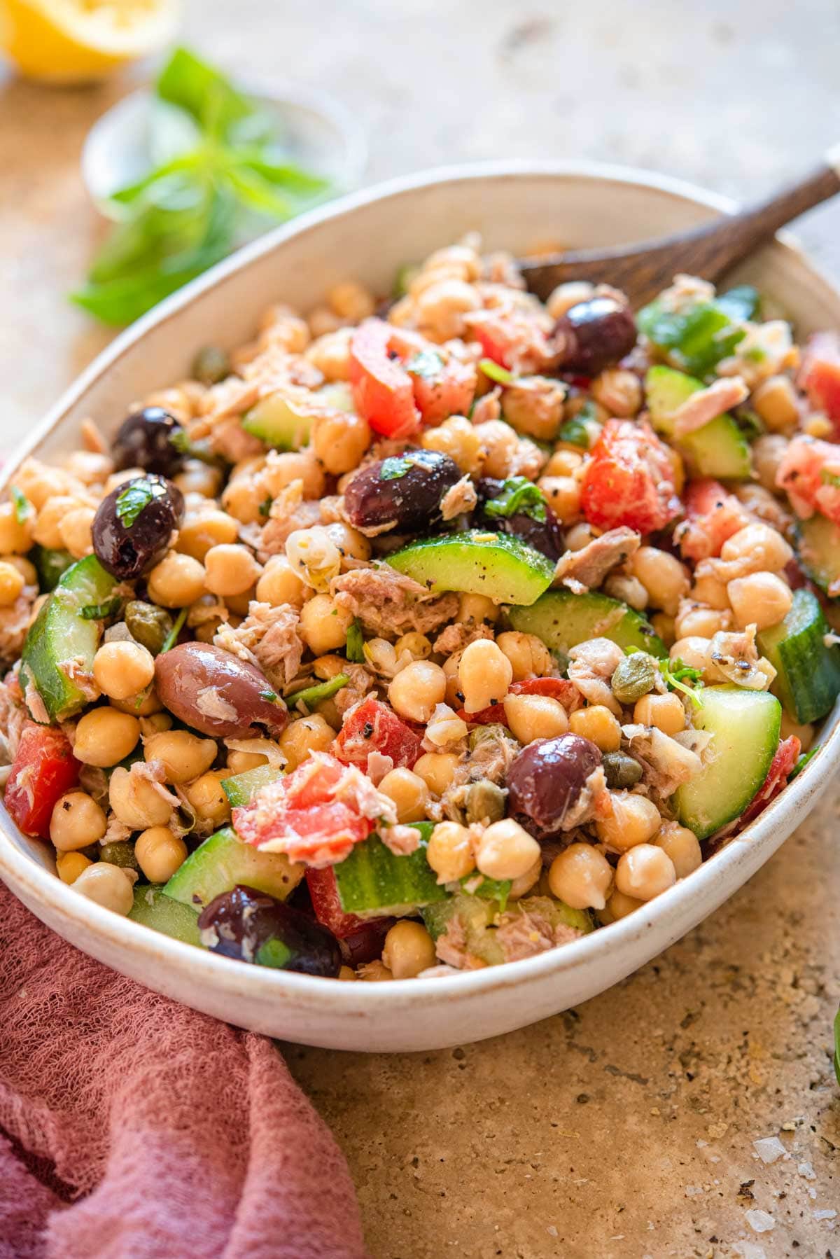 A side shot of a chickpea tuna salad in a large bowl