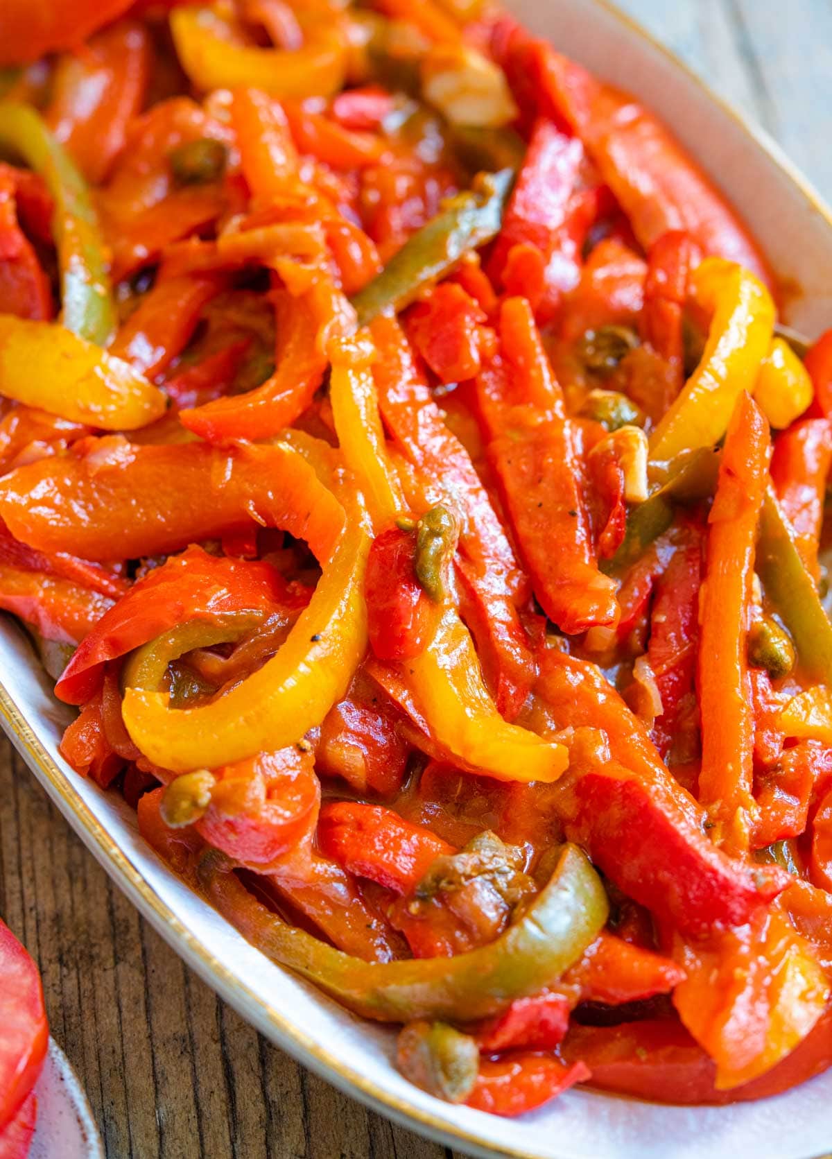 A close up of the texture of peppers in tomato sauce