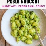 A pinterest graphic with a photo of pesto gnocchi in a rustic bowl