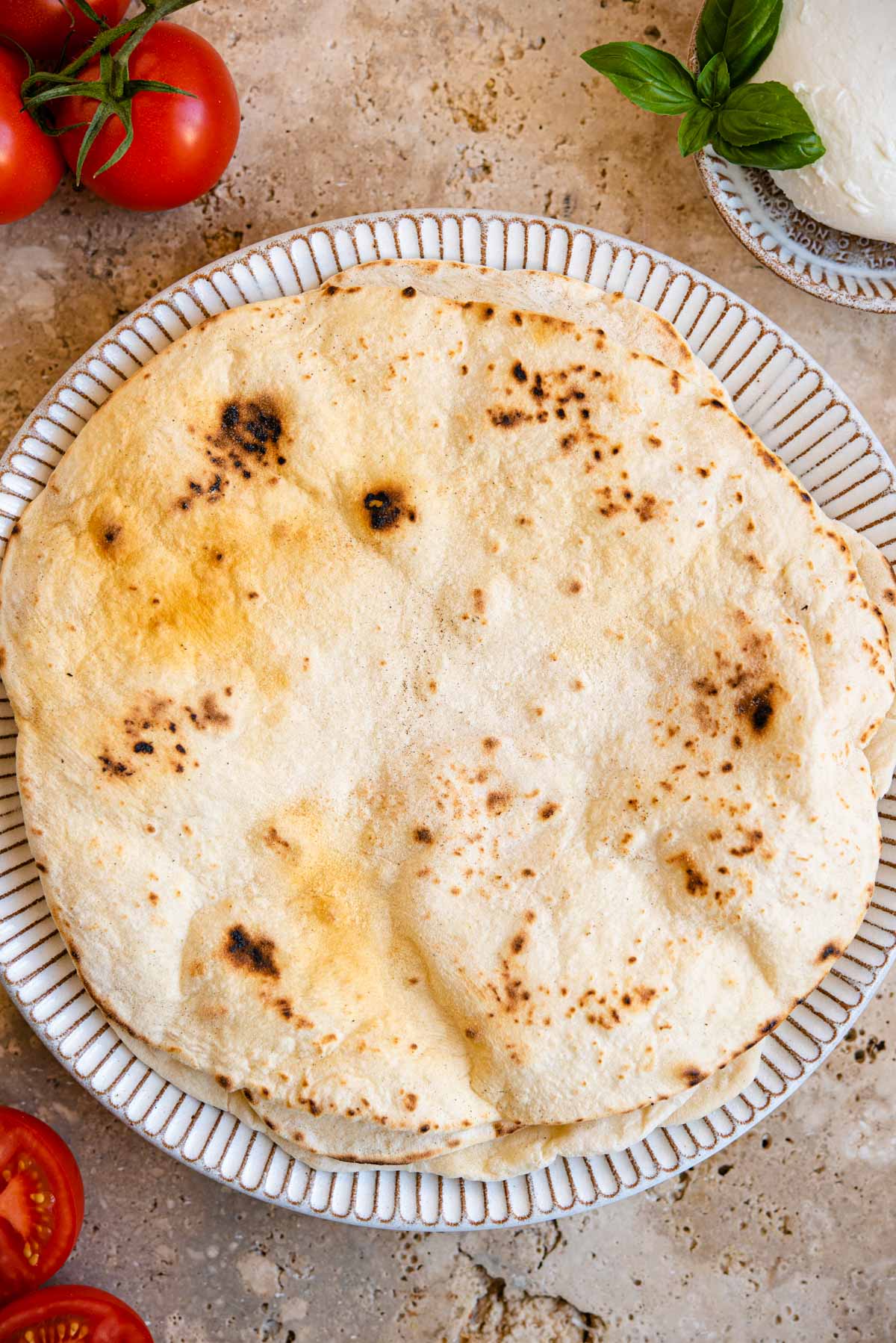 An overhead shot of Italian flatbreads on a rustic plate