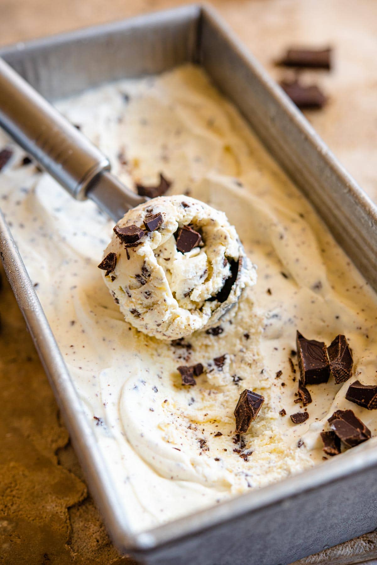 A close up of a scoop of stracciatella gelato