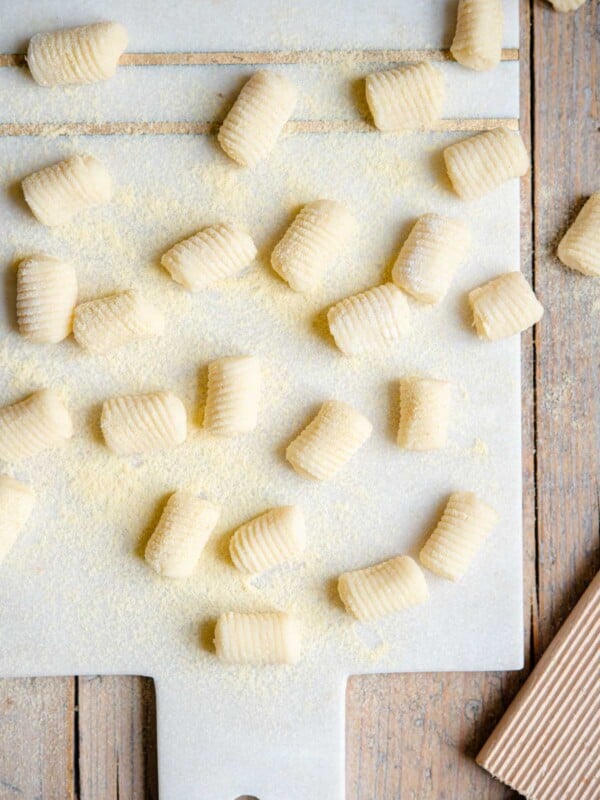 An overhead shot of gnocchi on a cutting board