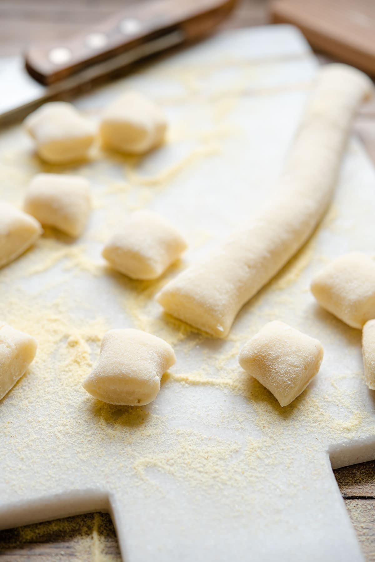 A close up of gnocchi on a cutting board