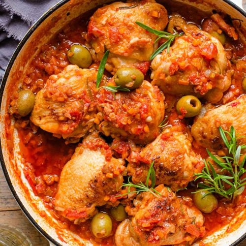 An overhead shot of chicken cacciatore in a skillet