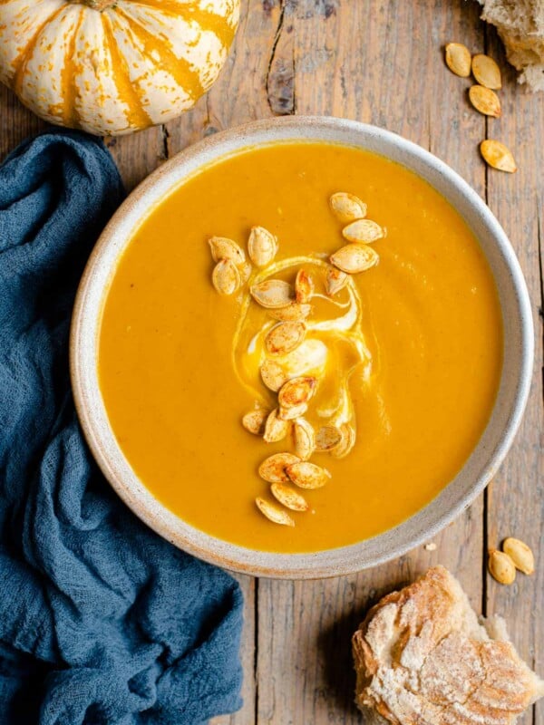 An overhead shot of pumpkin soup in a bowl