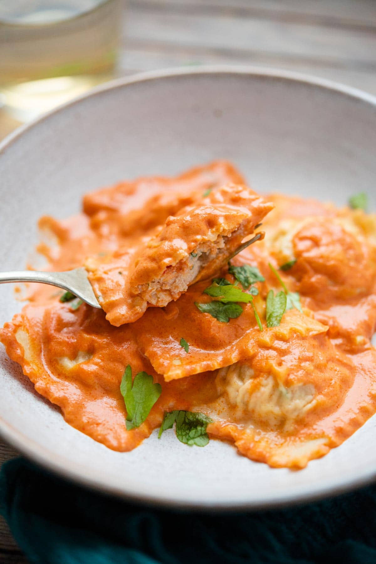 A close up of ravioli cut in half on a fork