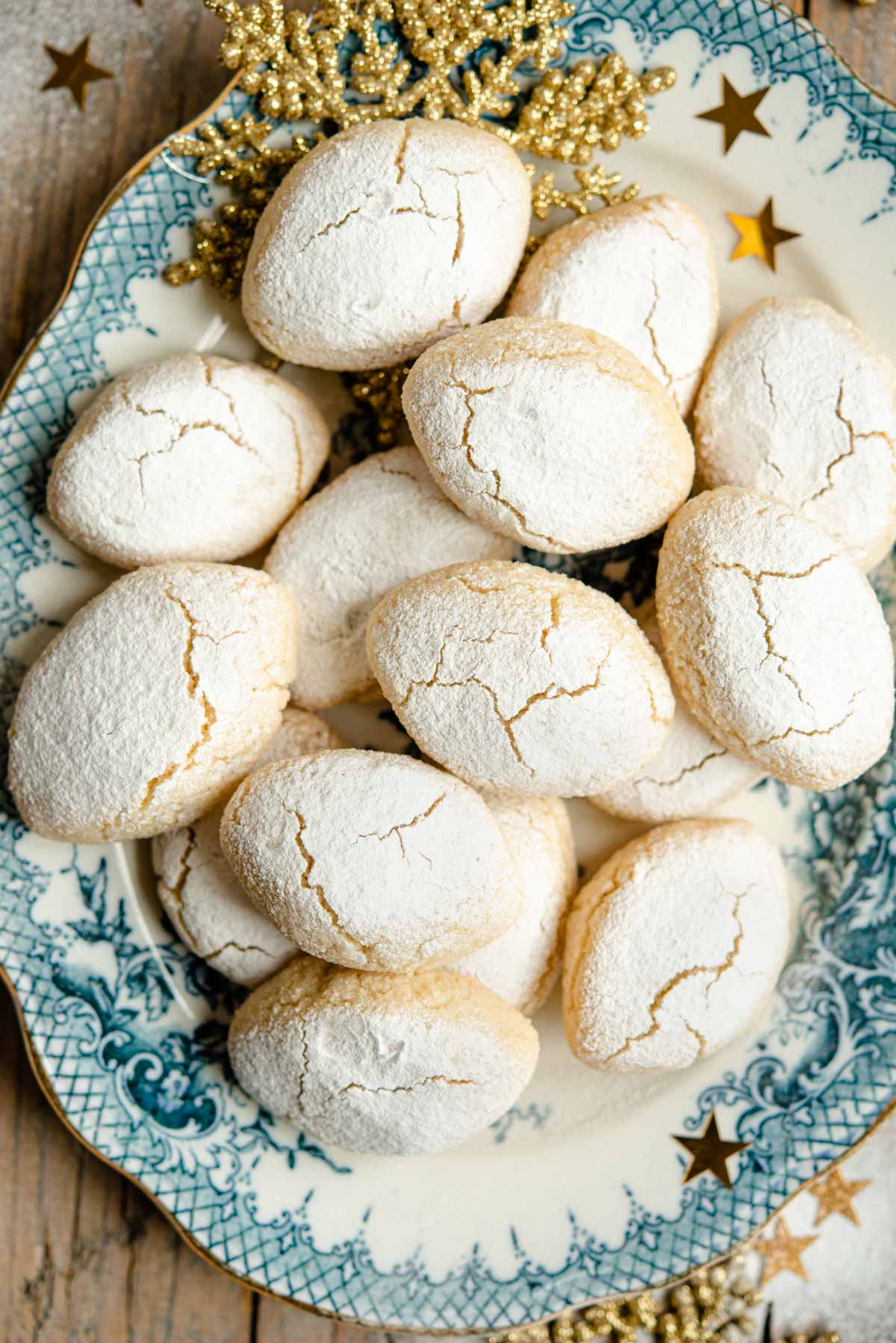 An overhead shot of a pile of Italian almond cookies on a serving plate