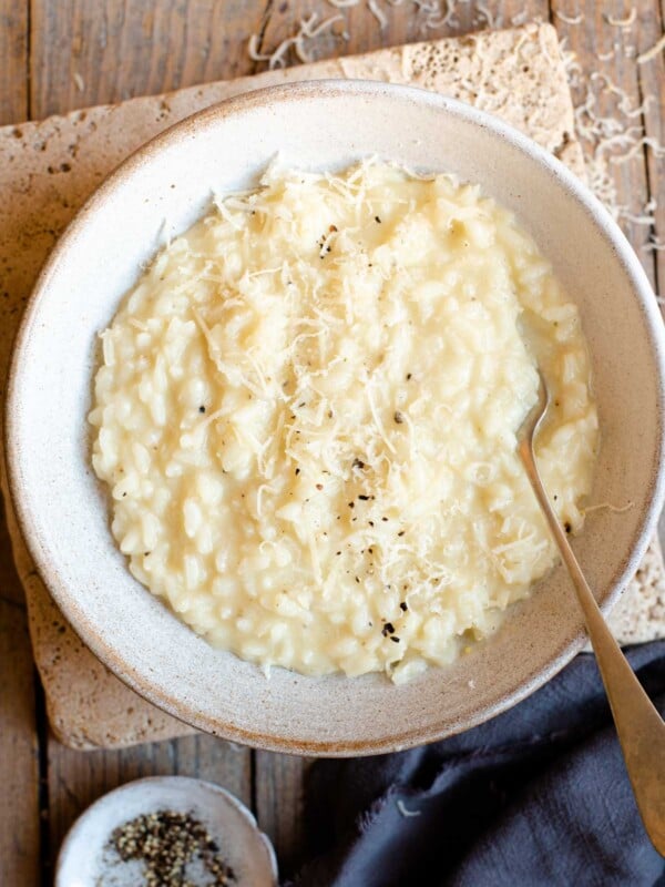 An overhead shot of cacio e pepe risotto in a bowl