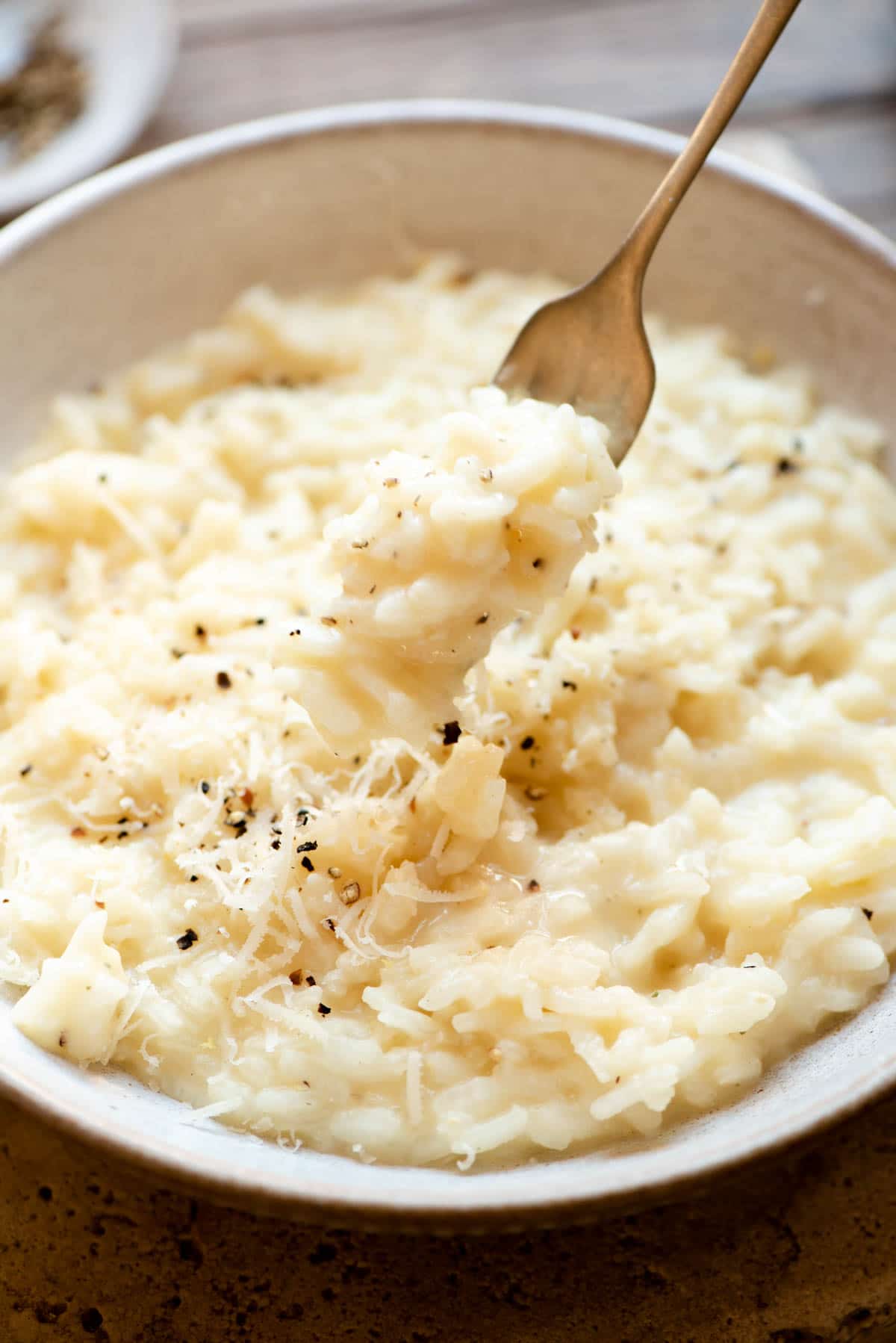 A close up of risotto on a fork
