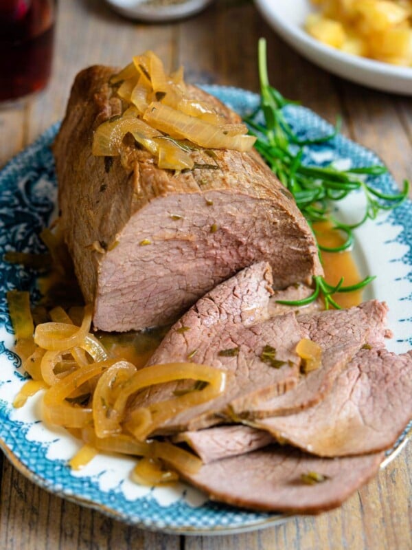 Italian roast beef on a blue serving platter