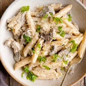 A close up of pasta alla boscaiola in a bowl