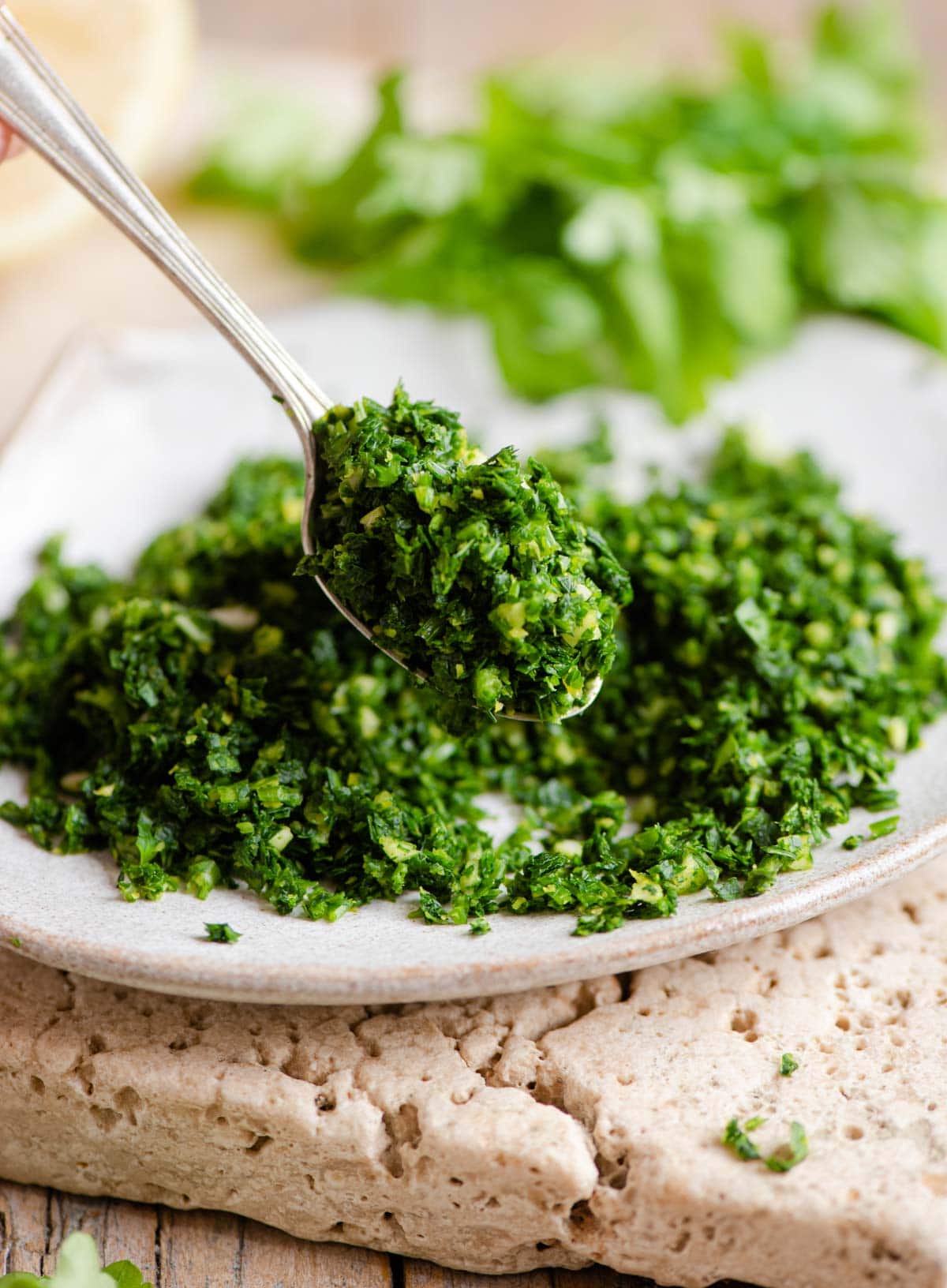 A close up of gremolata on a spoon