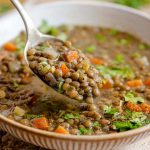 A close up of a spoonful of Italian lentil soup