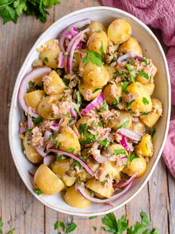 An overhead shot of a tuna potato salad in a large serving bowl