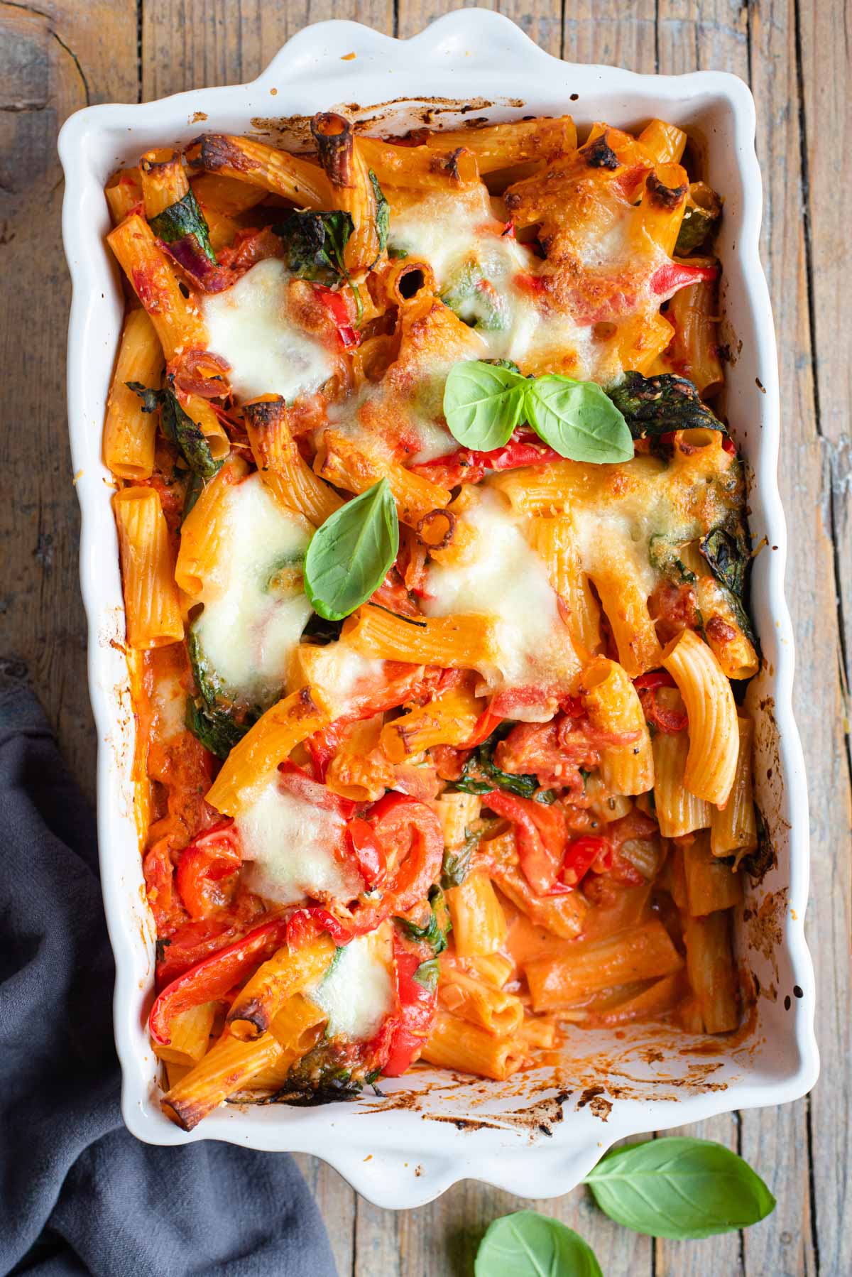 An overhead shot of vegetarian baked ziti in a casserole dish