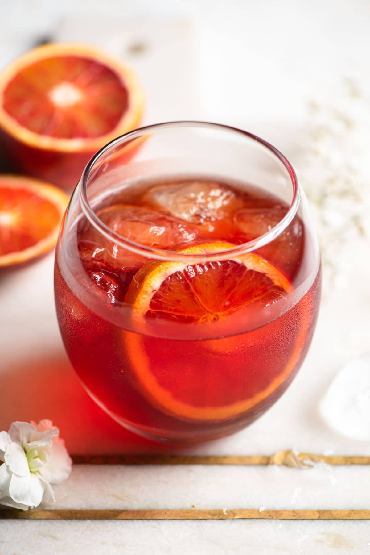 A close up of a Negroni Sbagliato in a round glass