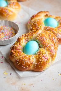 Italian Easter bread with a blue egg in the middle covered with sprinkles