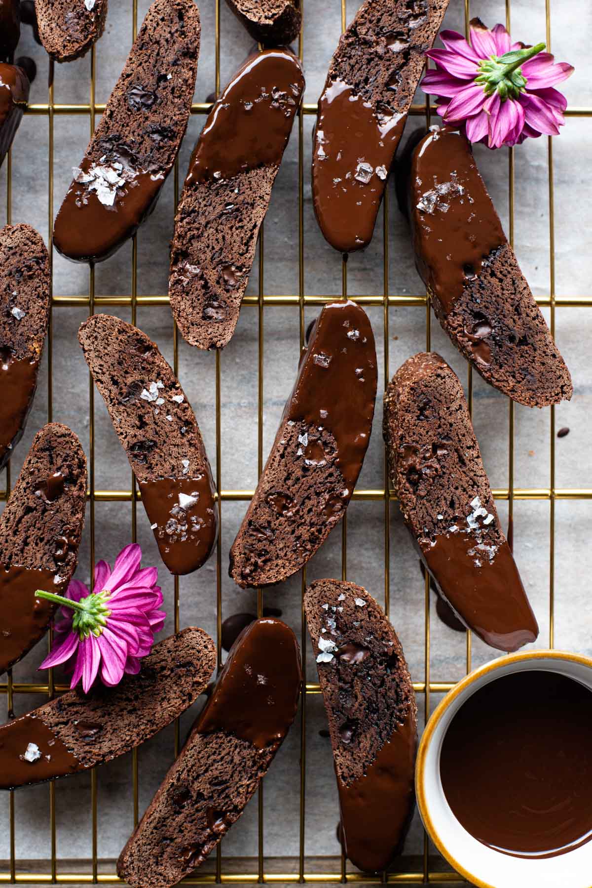An overhead shot of chocolate biscotti on a cooling rack
