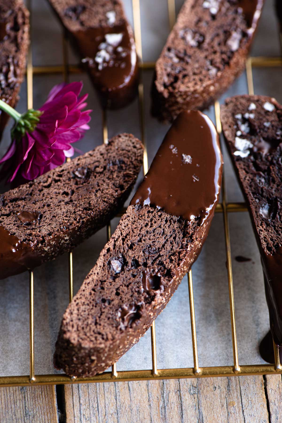 A close up of chocolate biscotti dipped in chocolate