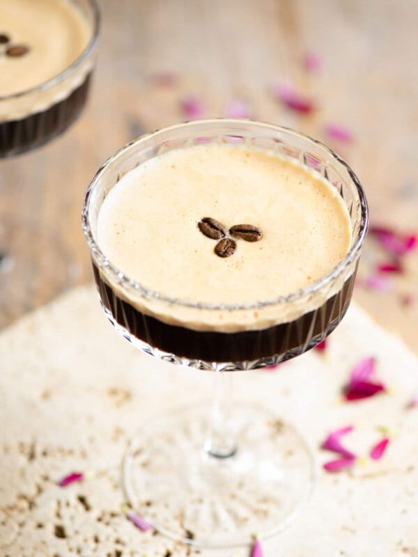 An espresso martini with 3 coffee beans on top