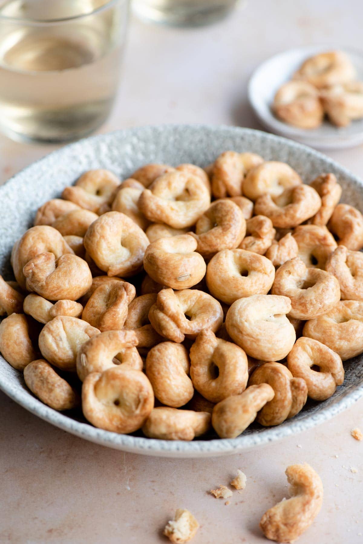 A side shot of Italian taralli in a serving bowl
