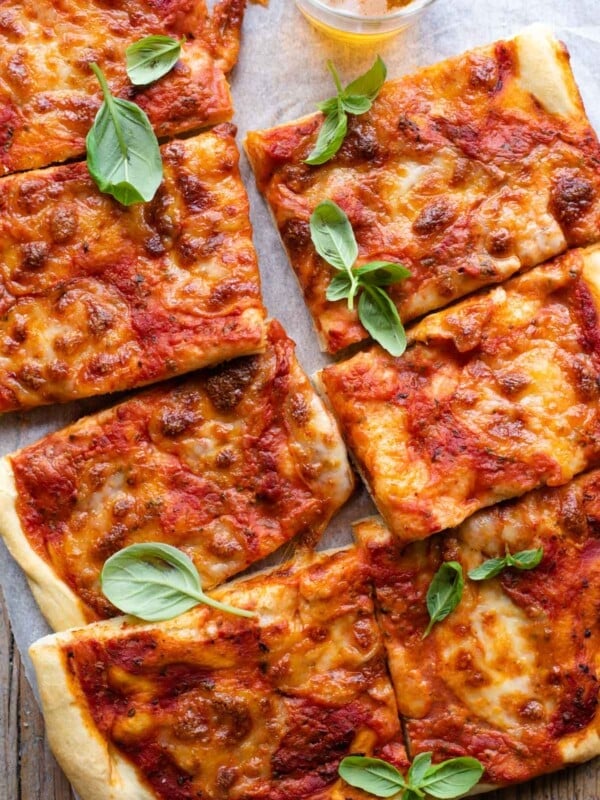 An overgead shot of a focaccia pizza cut into slices