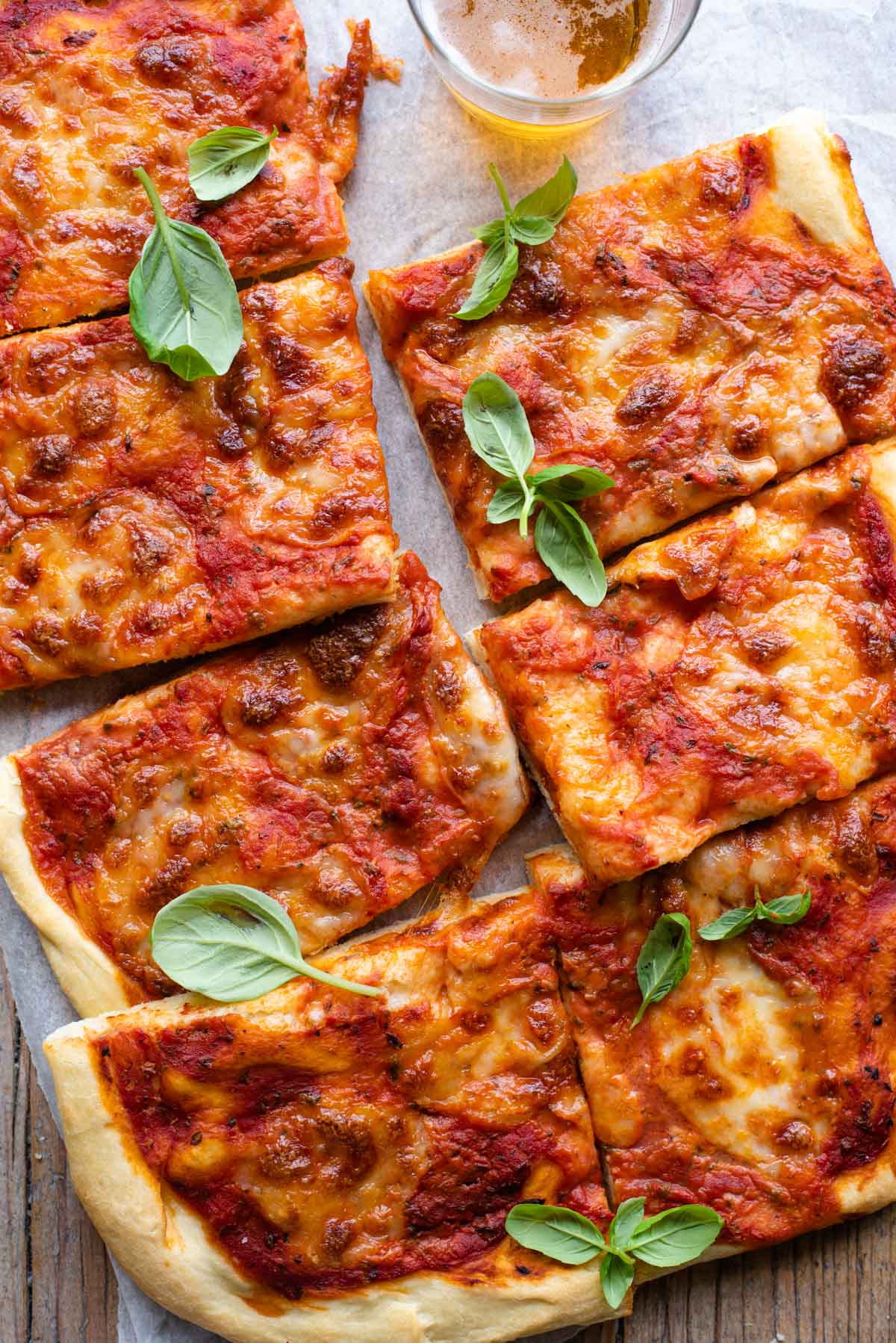 An overgead shot of a focaccia pizza cut into slices