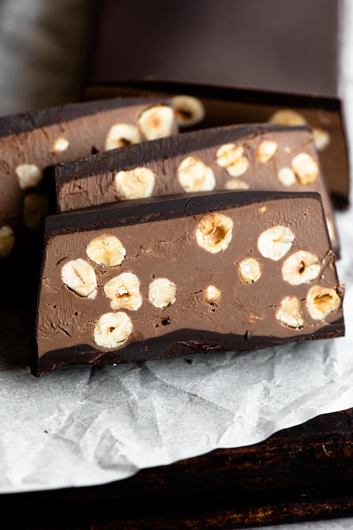 A close up of a chocolate hazelnut torrone cut into slices