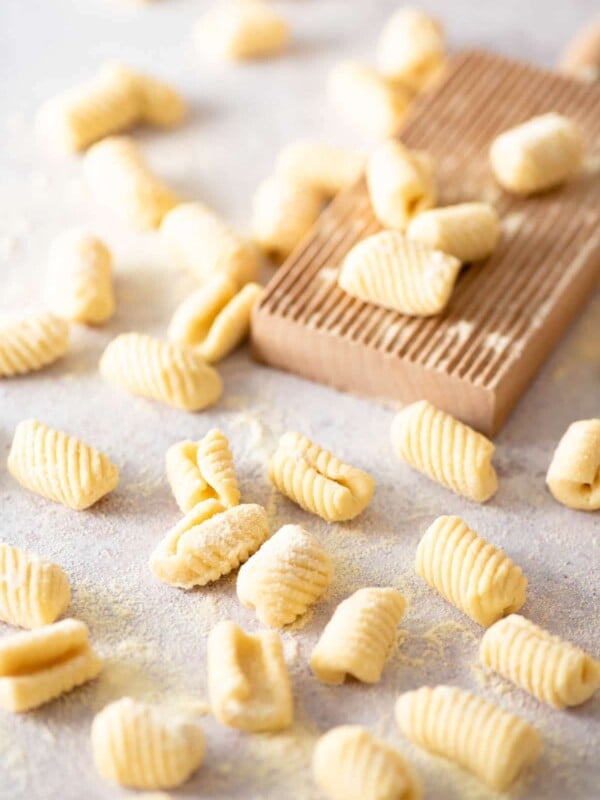 Gnochetti Sardi on a work surface with a gnocchi board