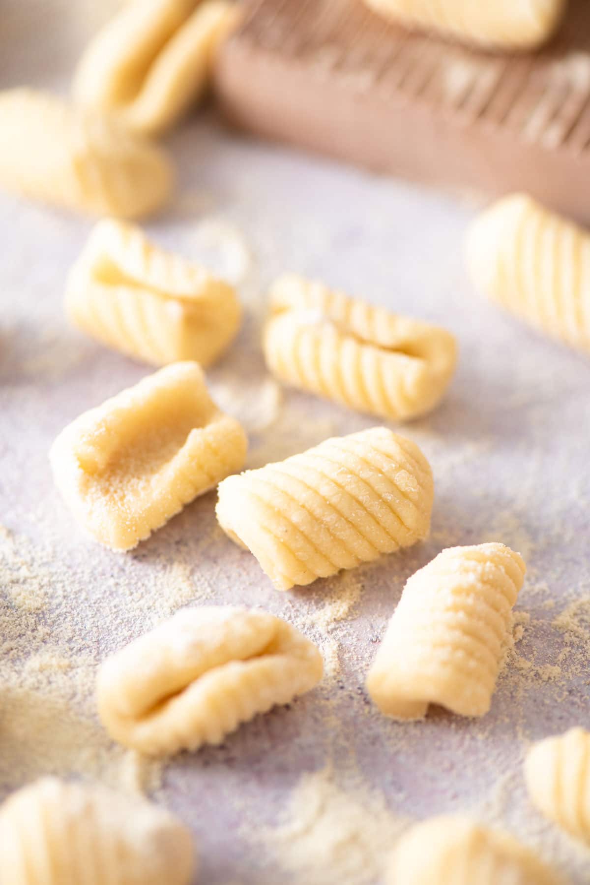 A close up of Gnocchetti Sardi pasta on a work surface