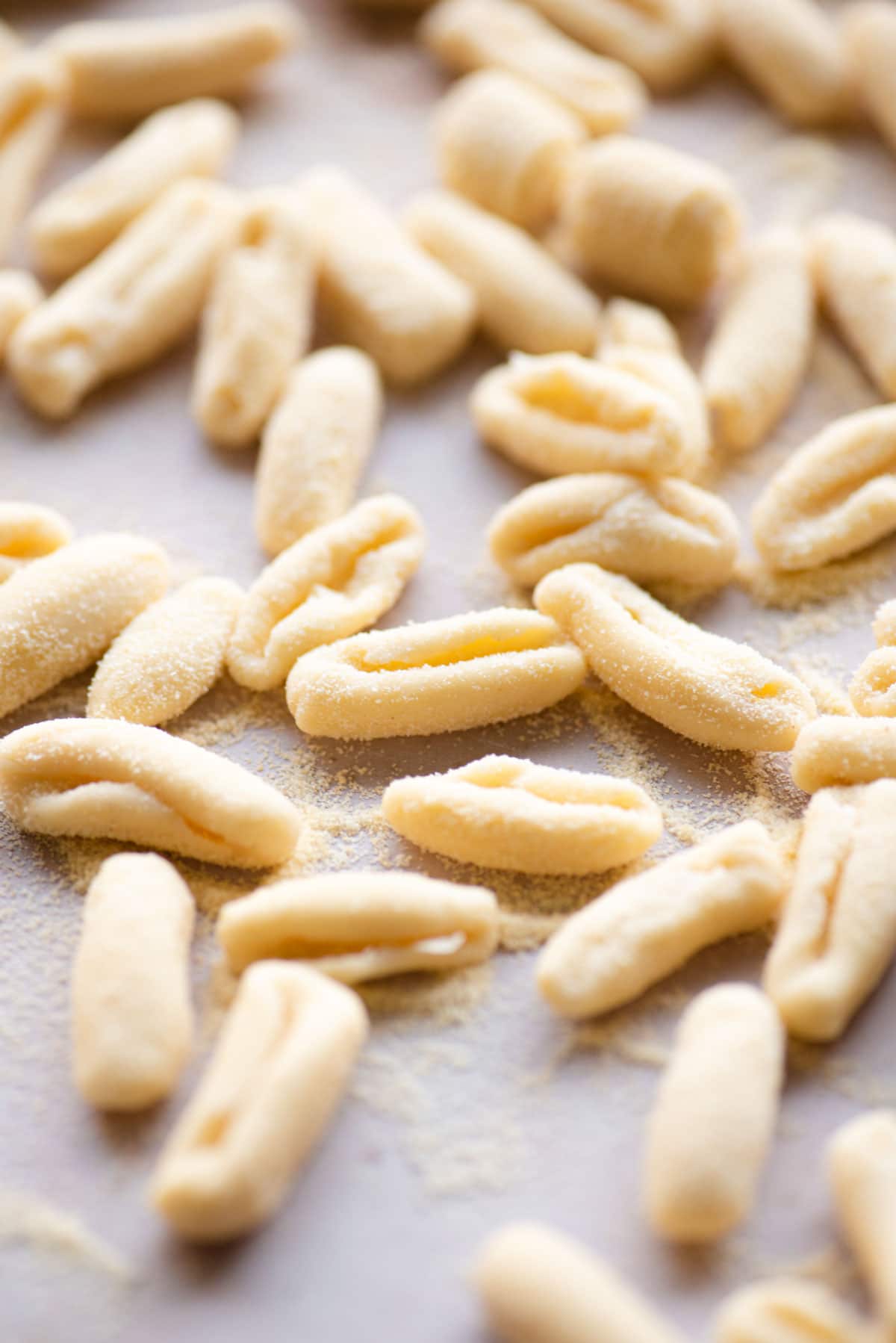 A close up of semolina pasta dough made into shapes
