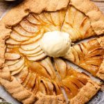 An overhead shot of an apple crostata with a scoop of ice cream in the middle