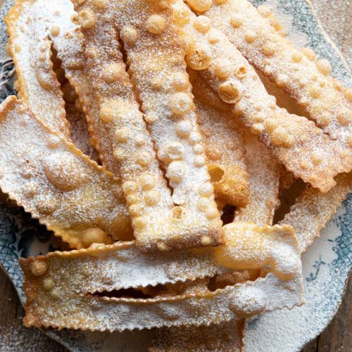 An overhead shot of Cenci Italian pastries on a blue plate