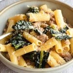 A close up of sausage and cavolo nero pasta in a bowl