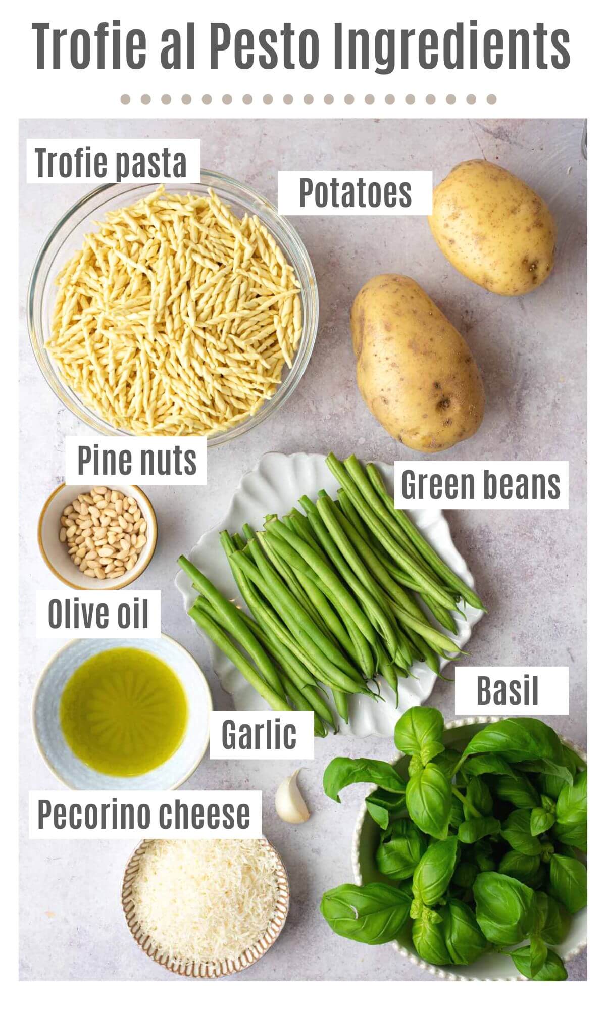 An overhead shot of all the ingredients you need to make Trofie al Pesto pasta