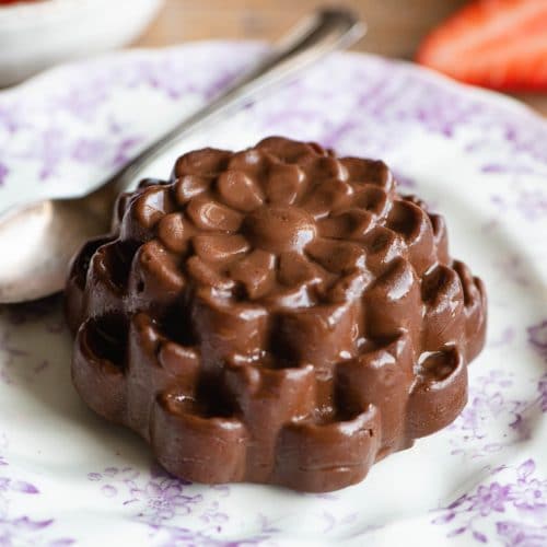 Chocolate Budino shaped like a flower on a small pink patterned plate