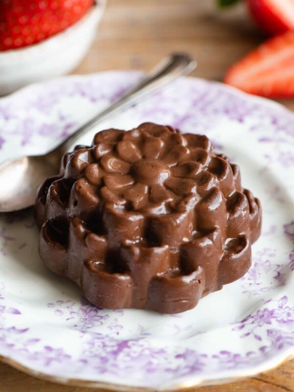 Chocolate Budino shaped like a flower on a small pink patterned plate