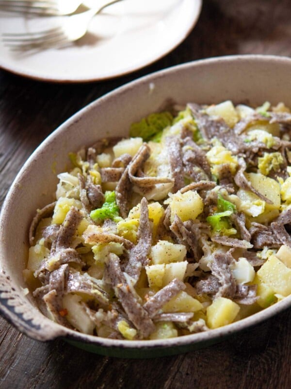 PIzzoccheri pasta in a baking dish with potatoes, cabbage and fontina cheese