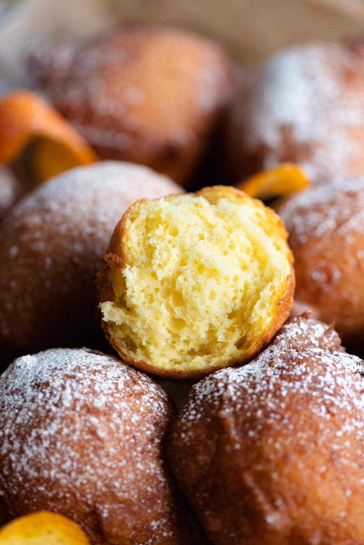 A close up of a ricotta doughnut cut in half