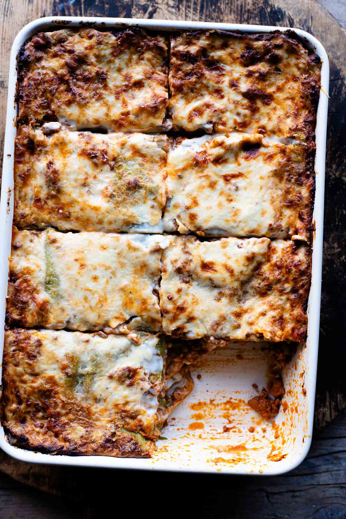 An overhead shot of lasagna bolognese in a large baking dish.